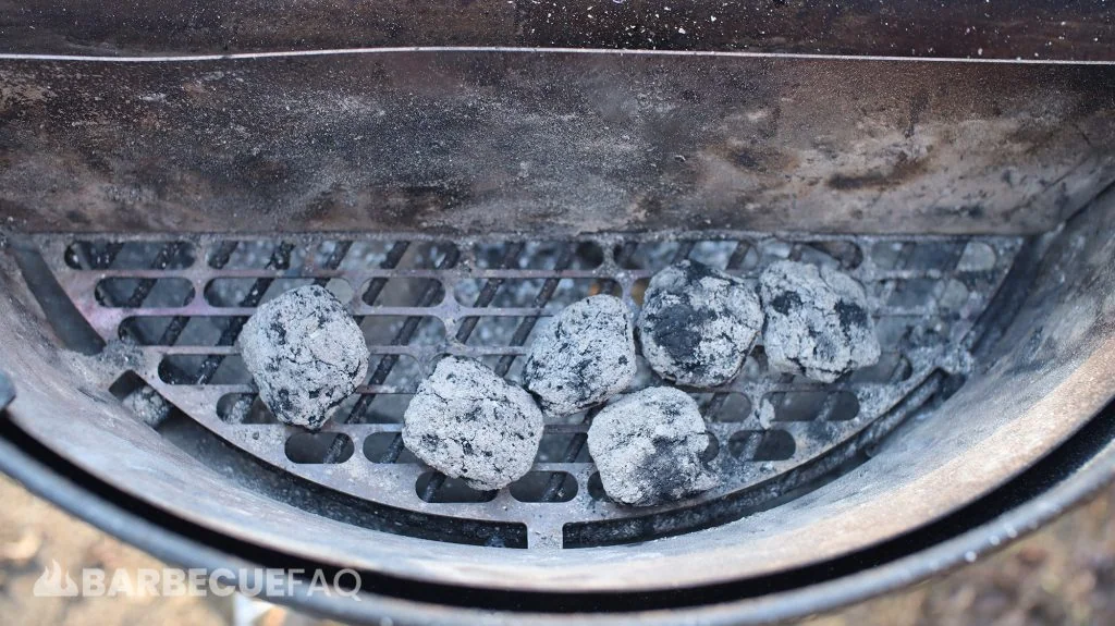 soaked charcoal still lit as indicated by the ashing over of the briquettes