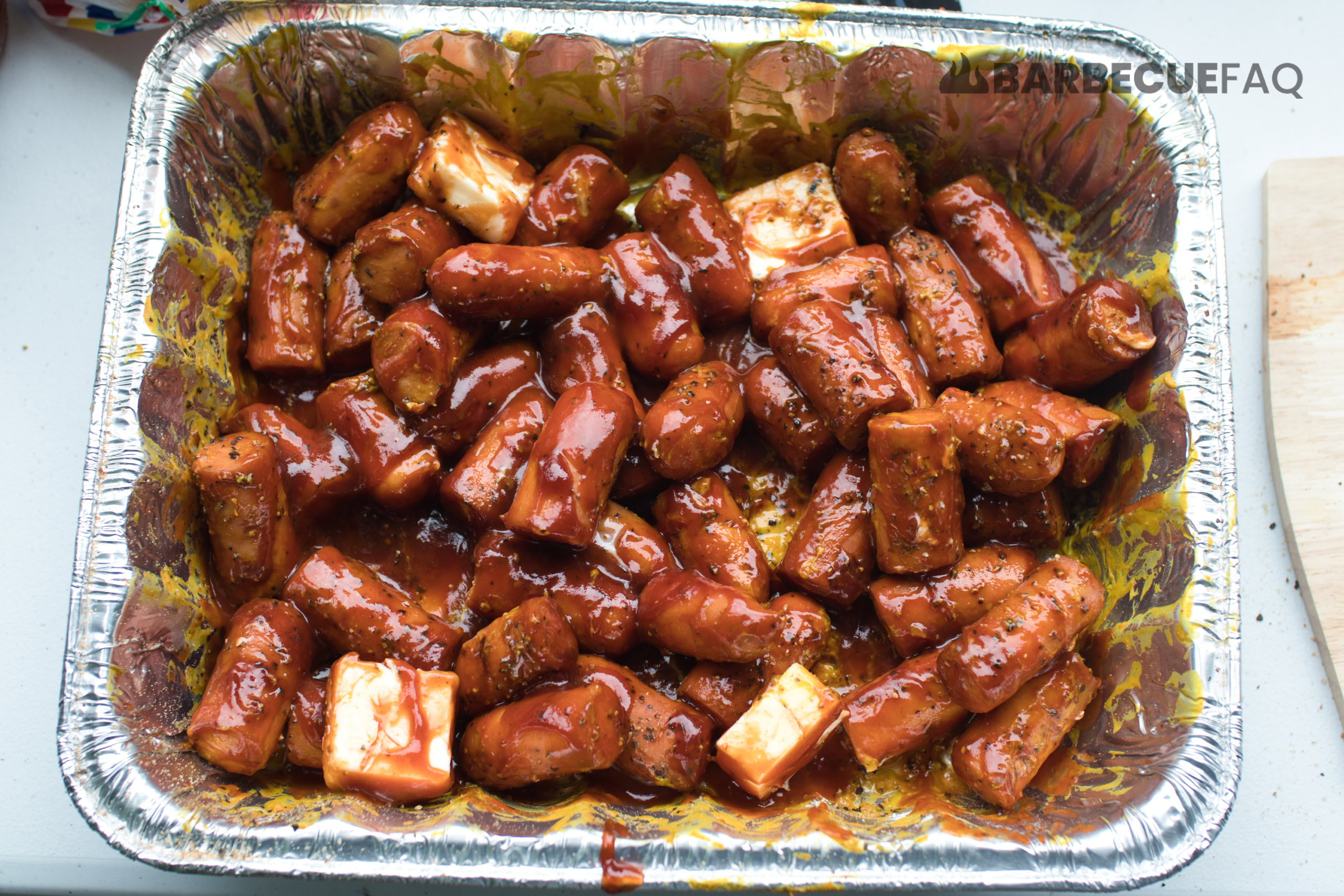 preparing hot dog burnt ends for glazing