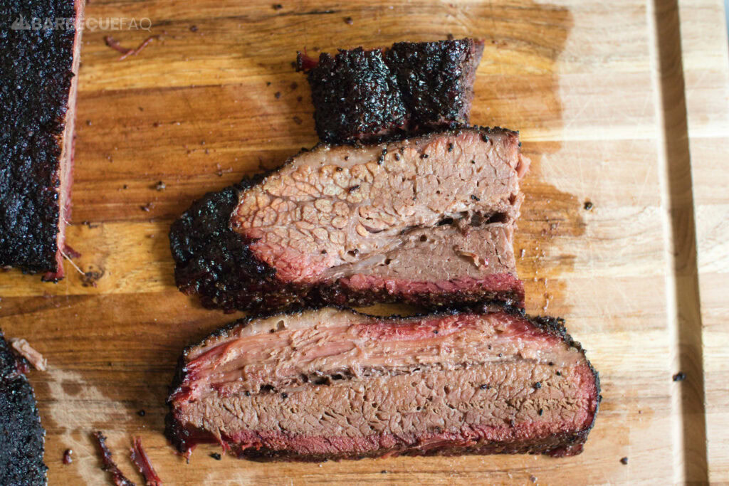 slices of brisket after smoking in a foil boat