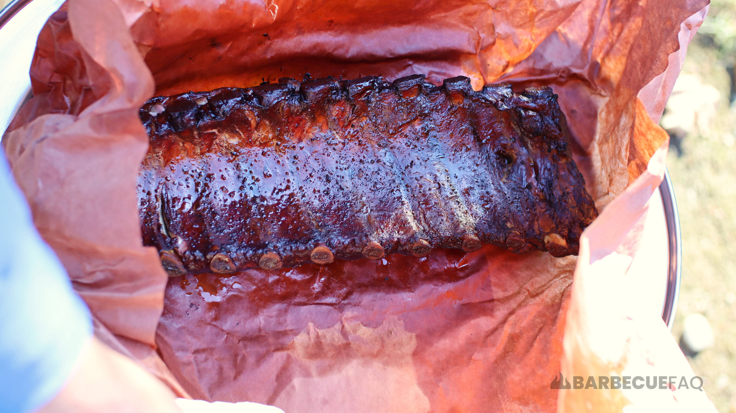 butcher paper wrapped ribs meat side down