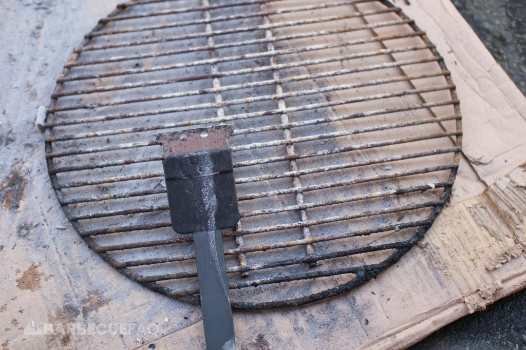 charcoal grates cleaned with grill brush