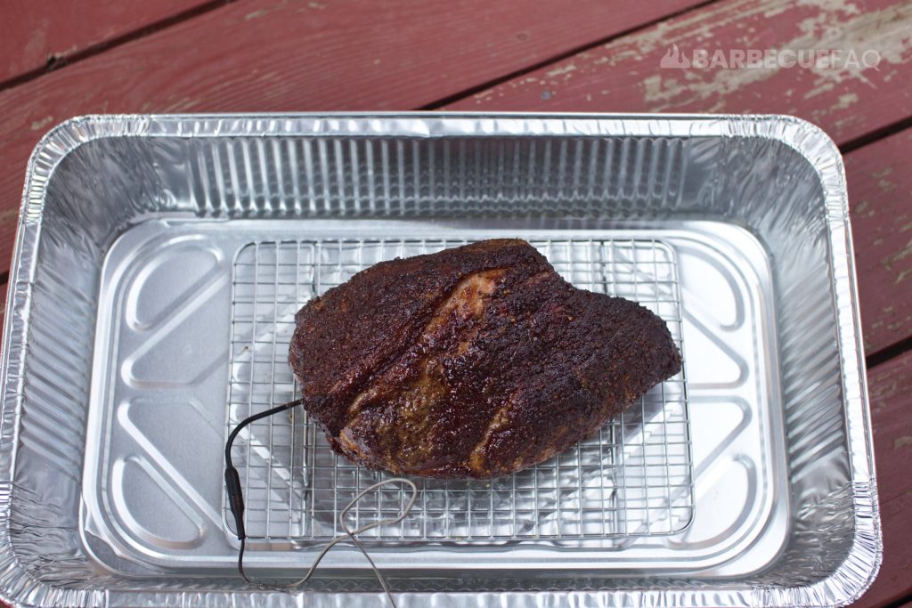 pork butt elevated in aluminum pan