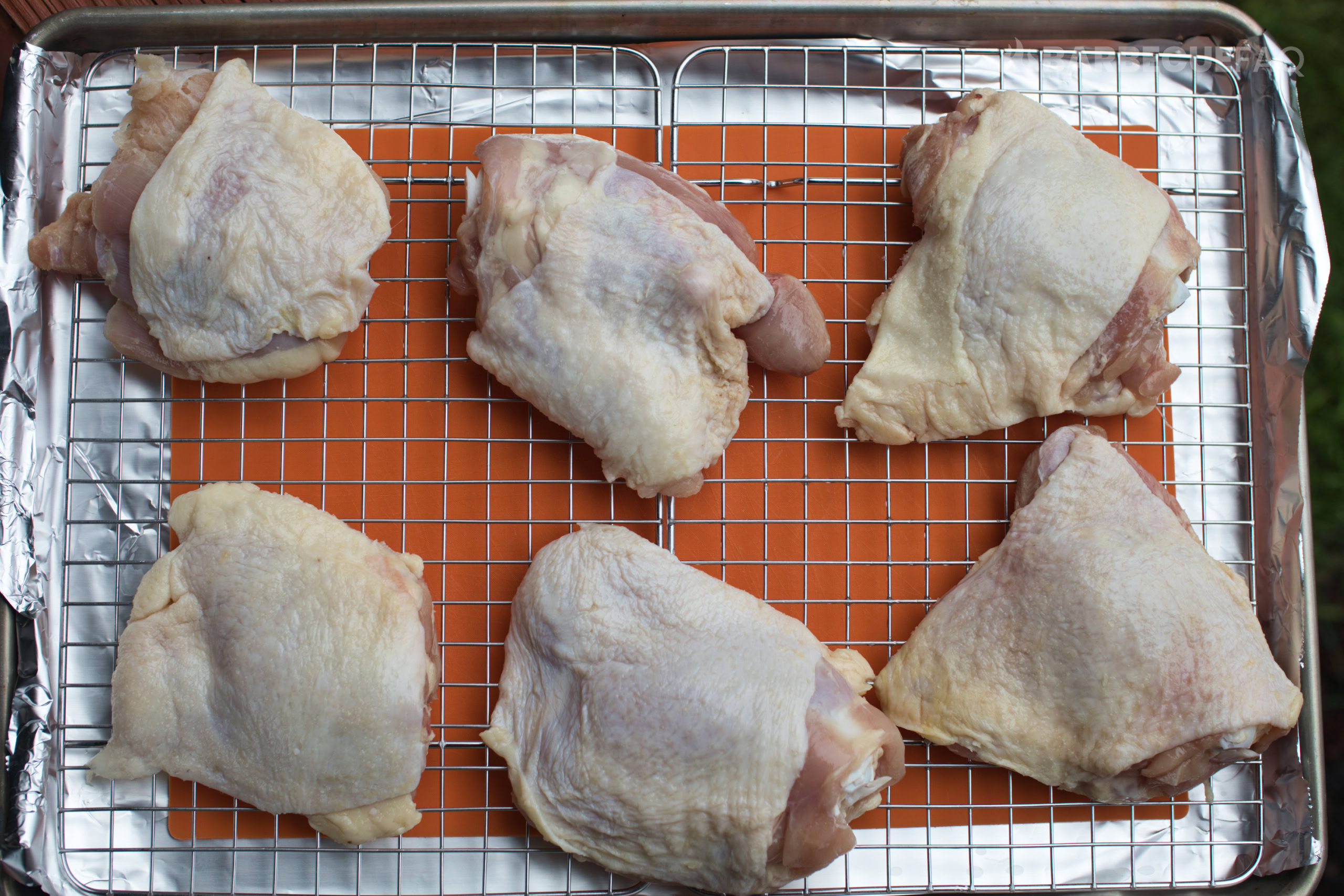 chicken thighs dry brining on cooling racks