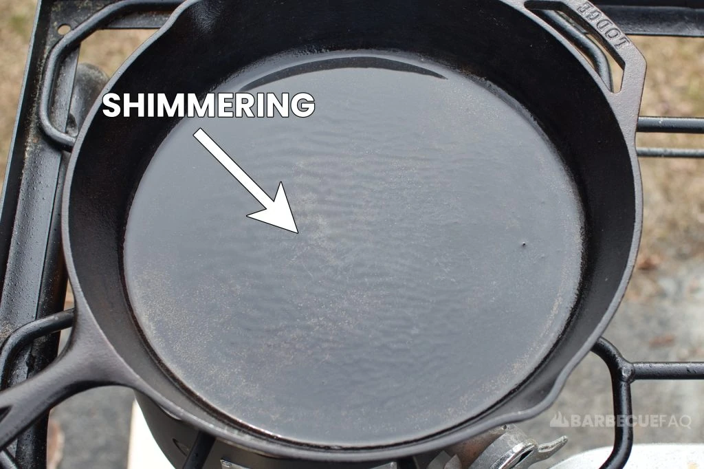 oil shimmering in cast iron skillet