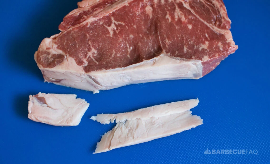 trimming fat on t-bone steak example