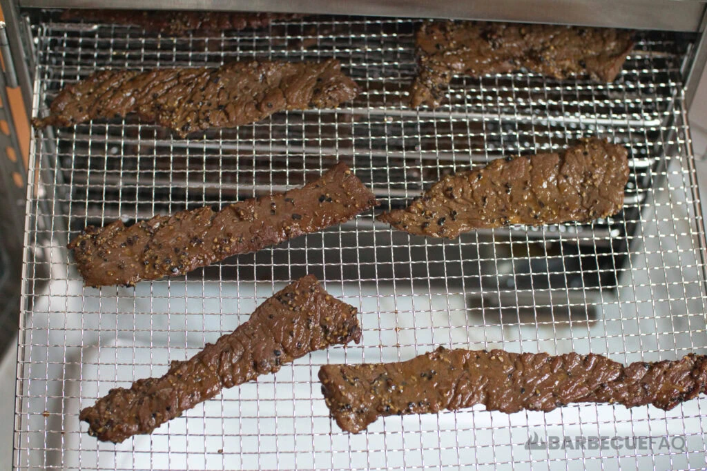 beef jerky on dehydrator trays