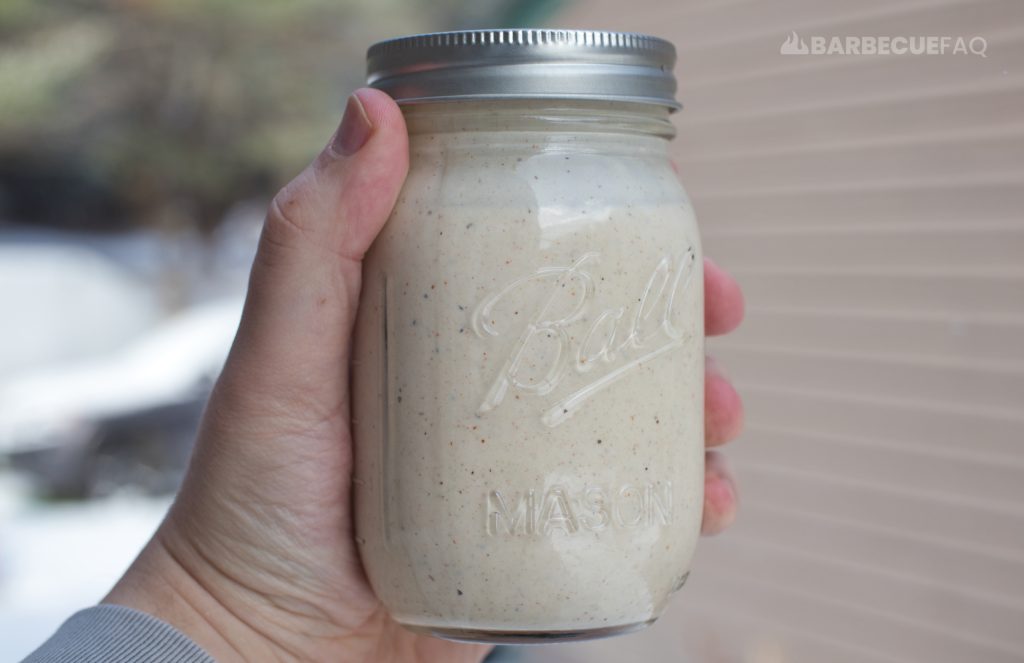 homemade Alabama White sauce in a small mason jar