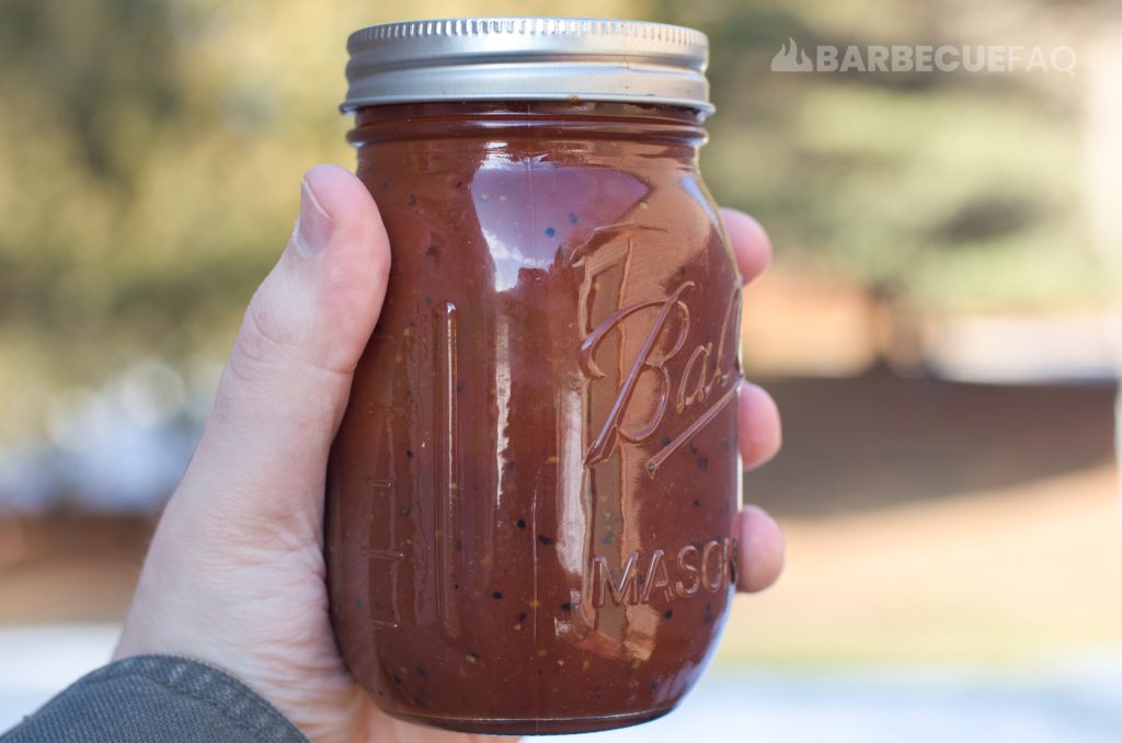 Texas-style bbq sauce in a small mason jar