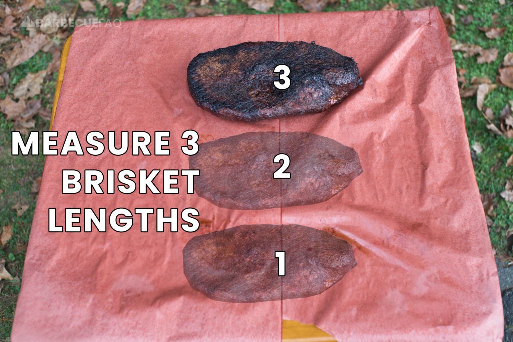 measuring 3 brisket lengths on the spritzed butcher paper