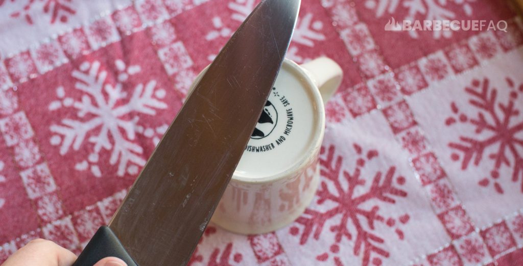 sharpening Victorinox knife with the underside of a ceramic coffee cup