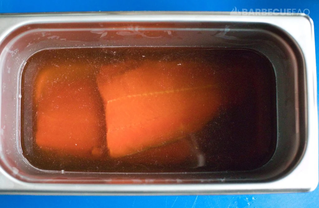 salmon in a container with simple brine