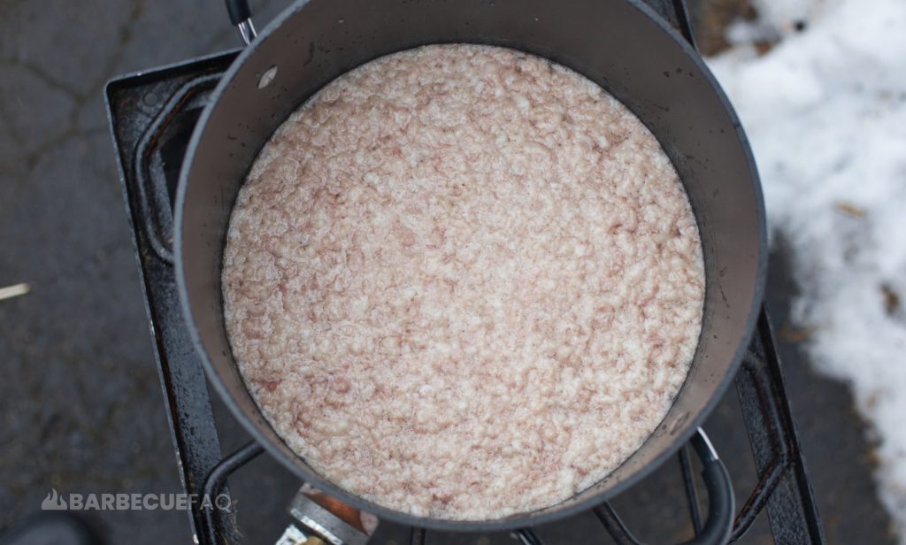 stock pot with water and brisket fat