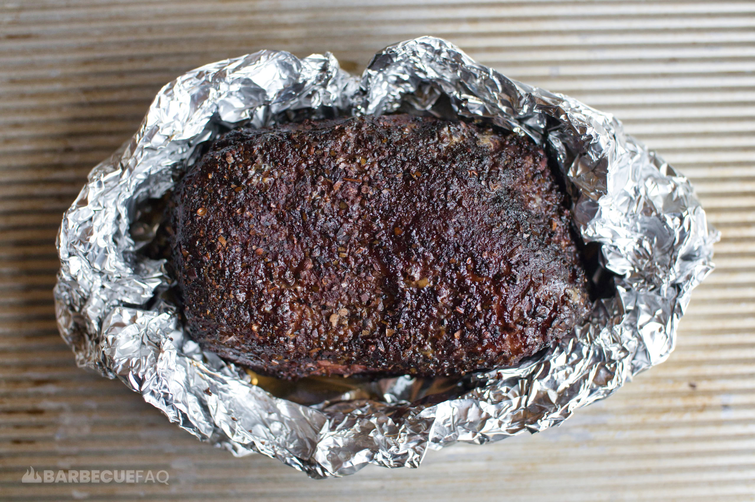 smoked corned beef in a foil boat