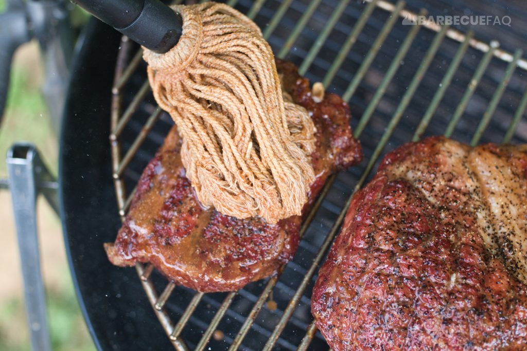 mopping pork steaks