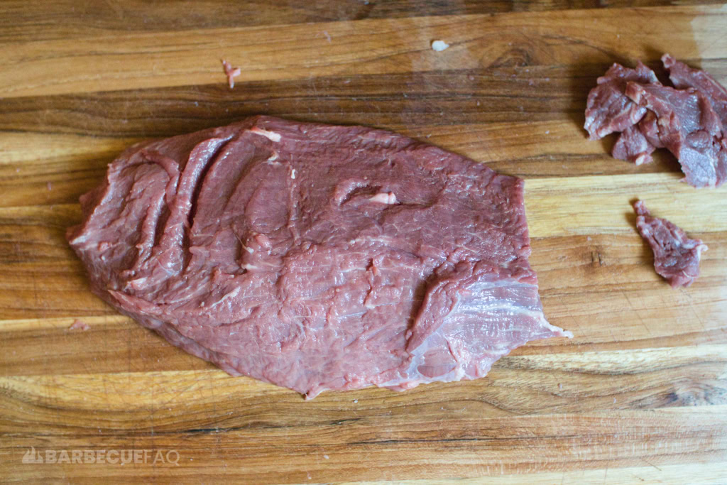 slicing sirloin tip against the grain