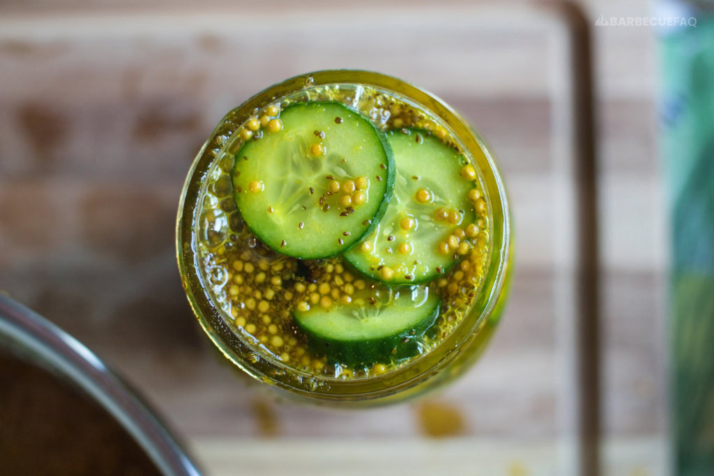 brining liquid ladled into mason jar