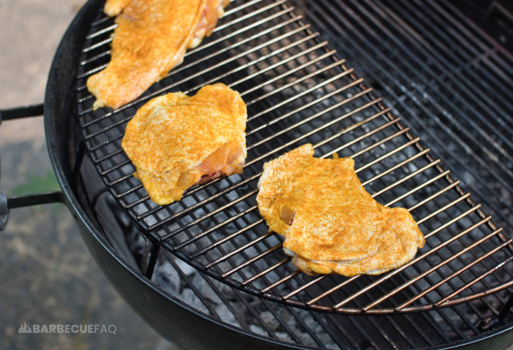 chicken thighs seasoned on grill