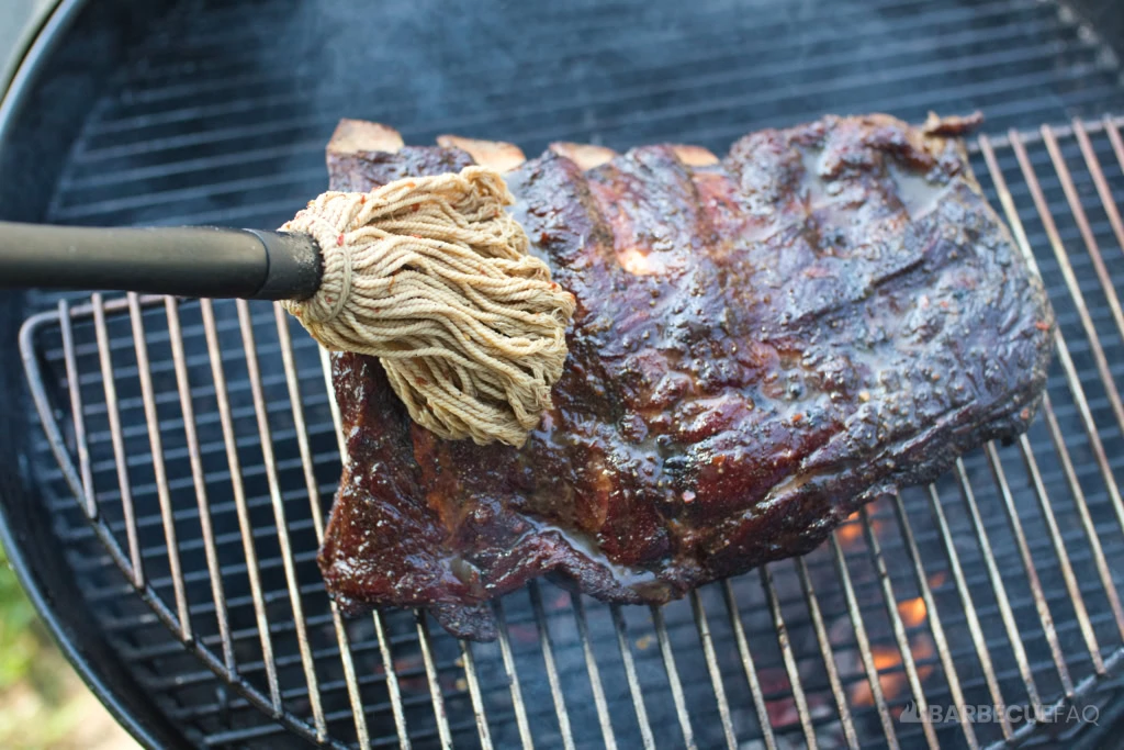 mopping beef back ribs liberally