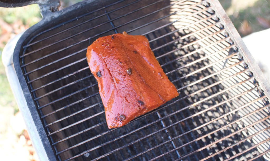 chili crisp salmon on a charcoal grill indirect