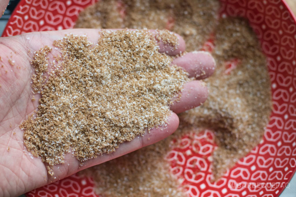 person holding homemade granulated brown sugar in their hand