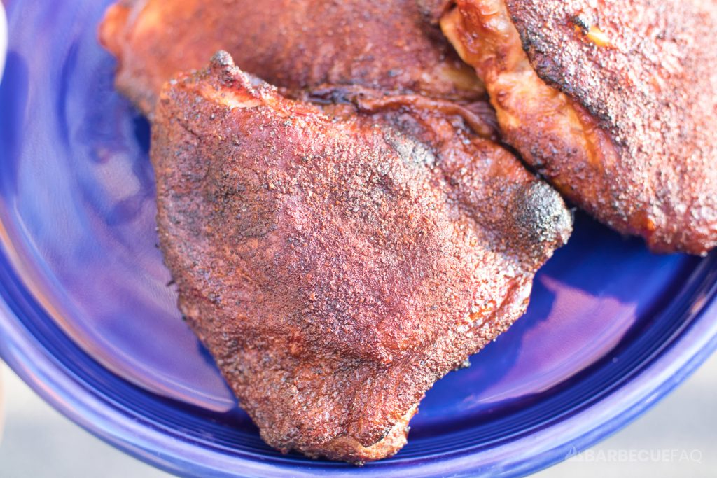 smoked chicken thighs that used chipotle and adobo in rub for red color