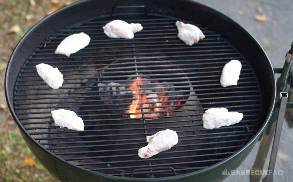 chicken wings cooking on the weber kettle with the vortex in the middle