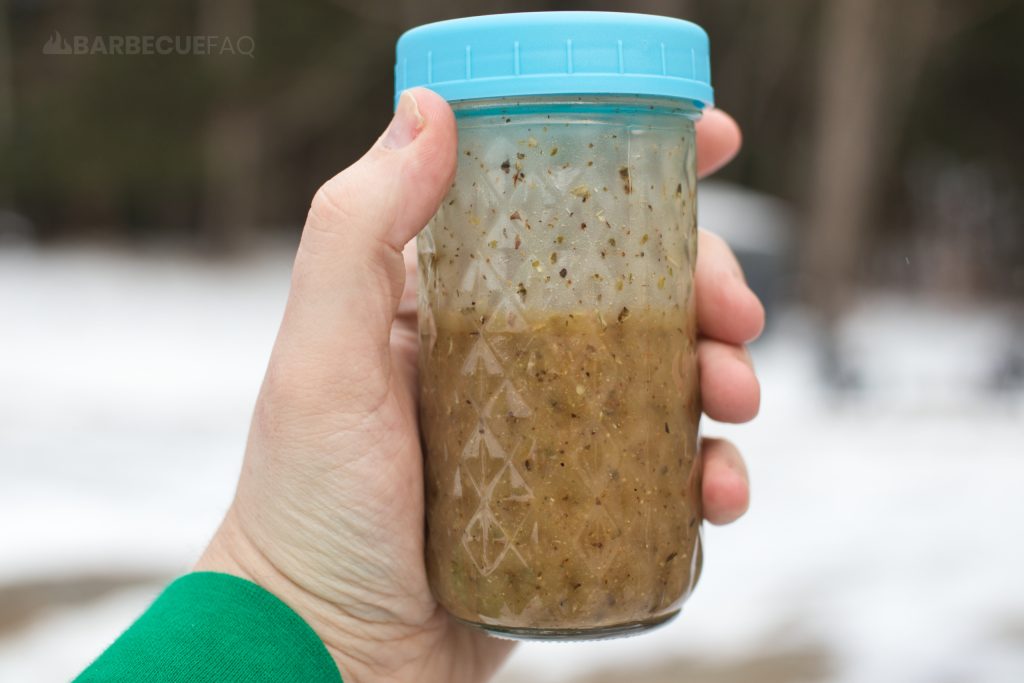basic submarine sandwich oil recipe in a tall glass mason jar with a blue lid