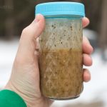 basic submarine sandwich oil recipe in a tall glass mason jar with a blue lid