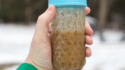 basic submarine sandwich oil recipe in a tall glass mason jar with a blue lid