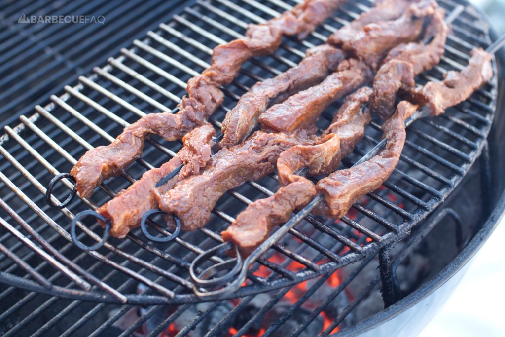 steak on a stick on the grill