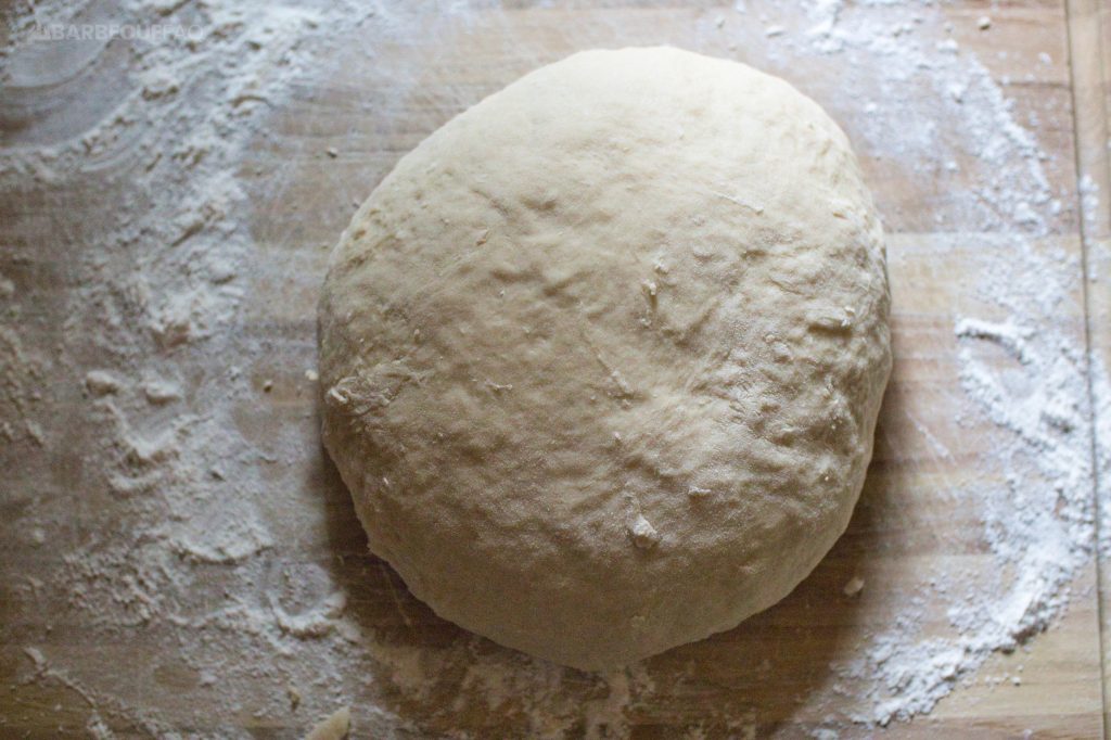 dough after kneading for 4 minutes on a floured wooden cutting board
