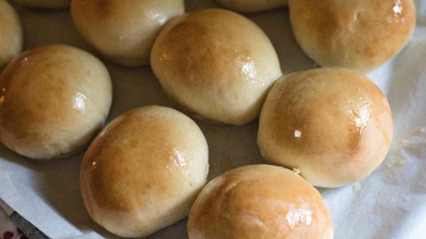 steakhouse rolls after baking. The tops are shining due to the garlic butter.